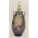 A Royal Doulton flambe twin handled vase, by Florrie Jones decorated with roses,