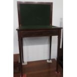 An Edwardian mahogany card table, the rectangular swivel top on square tapering supports,