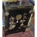 A Chinese black lacquered cabinet,