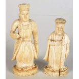 Two Chinese ivory chess pieces in the form of courtiers standing on plinth bases, heights 6.