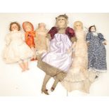 A group of six vintage dolls including wax head with inset eyes,