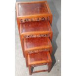 A set of Chinese hardwood quartetto tables, each with a rectangular burr wood top,