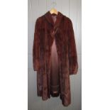 A three quarter length fur coat.