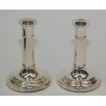 A pair of plain modern filled silver candlesticks, height 14.