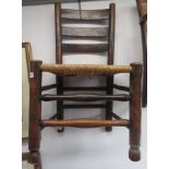 A 19th century ladderback rush seated dining chair.