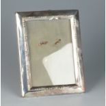 An Edwardian silver mounted photograph frame.