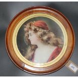 A circular print of a gypsy girl, in a walnut frame, diameter 32cm.