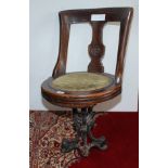 A late 19th century walnut ship's swivel dining chair,