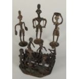 An African bronze tribal group of a band and three other figures, height of highest 17cm.