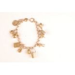 A 15ct gold chain bracelet with thirteen 9ct gold charms, 34g.