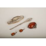 A Cornish Stone Company silver mounted "amber" brooch and a pair of matching earrings together with