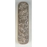 A Chinese silver brush back, decorated with a flowering tree, signed HC, length 17.3, width 4.5cm.