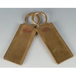 A pair of brass railway tallies, with inscribed oval copper plaques, length 18.7cm.