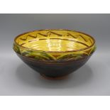 A Clive Bowen Studio Pottery bowl, with a yellow glazed interior, height 13.5cm, diameter 29cm.