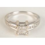 An 18ct white gold ring with a square of four calibre set diamonds,