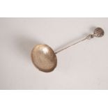 A Chinese white metal ladle, signed to the rear of the handle,