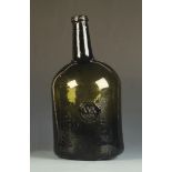 An 18th century green glass wine bottle, bearing a seal marked W:K 1792,