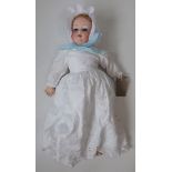 A porcelain head doll by Armand Marseille, the porcelain head with sleep eyes, open mouth and teeth,