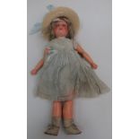A German porcelain headed doll, the head with sleep eyes,