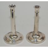 Two plain Georgian style filled silver candlesticks, height 21.7 and 21.