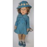 A child doll by Chad Valley, the felt moulded head on a felt part articulated body,