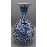 A Chinese blue and white porcelain baluster vase, decorated with two mythical beasts,