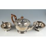 A bats wing fluted silver teapot,