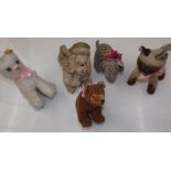 A felt Dismal Desmond toy dog, together with a musical poodle, damaged, and three other soft toys.