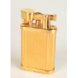A gold plated Dunhill Unique gas English made lighter serial 396473 boxed maximum height 47mm.