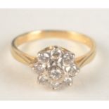 An 18ct gold diamond 9 stone cluster ring.