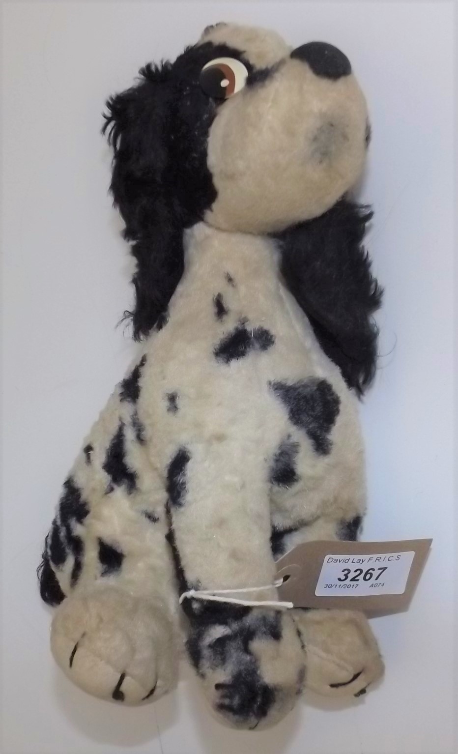 A Merrythought black and white spotted spaniel, applied plastic eyes, Merrythought label to pad.