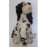 A Merrythought black and white spotted spaniel, applied plastic eyes, Merrythought label to pad.