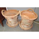 A pair of Lake's terracotta flower pots and stands,