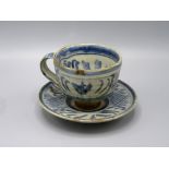 A Seth Cardew Studio Pottery cup and saucer, height 8.5cm, diameter of plate 13cm.