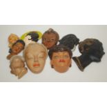 Nine plaster female wall masks, largest length 32.5cm.