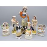Two Staffordshire pottery groups, 19th century, height 12cm and five other figures.