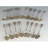 A collection of eighteen English and Scottish 19th century plain fiddle pattern teaspoons. 10.7oz.