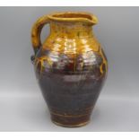 A Clive Bowen Studio Pottery jug, the brown and ochre glazed body decorated with abstract designs,