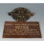 A circular GWR iron locomotive plate cast with the wording 'Registered By The GWR Co.