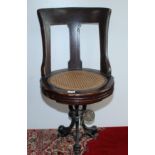 A late 19th century walnut ship's swivel dining chair,