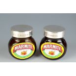 A 125g jar of Marmite with a plain silver lid together with a silver lidded empty jar.