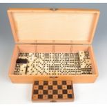 A miniature carved wood chess set, in folding box/board, inscribed 'C.H J.