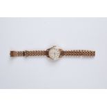 A ladies Omega gold cased wrist watch on gold bracelet. Condition report: 9ct.