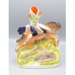 A Staffordshire pottery spill vase, 19th century, of Mazeppa strapped to his horse, height 23cm.