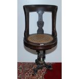 A late 19th century walnut ship's swivel dining chair,