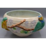 A Clarice Cliff pottery bowl, with two parrots perched on a branch, height 12cm, diameter 20cm.