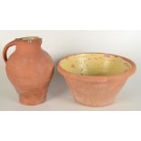 A terracotta jug and bowl set, height of jug 33cm, height of bowl 20cm.