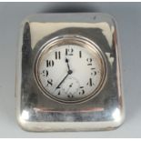 A nickel eight day timepiece in plain silver mounted travelling case, Birmingham 1923.