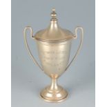 A small silver trophy cup and cover, 2oz.