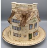 A London pottery stilton dish and cover, modelled as the 'Bell Inn, 1642',